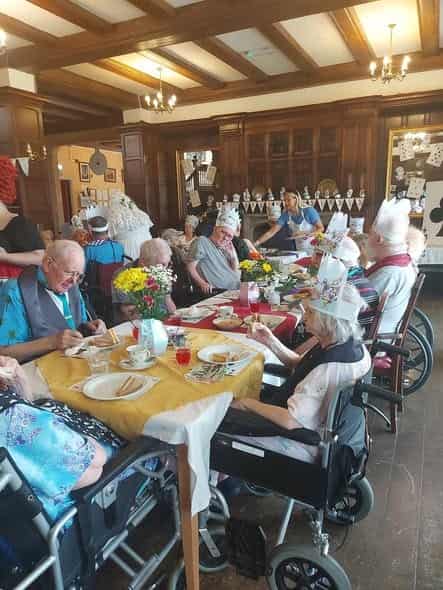 Residents enjoying afternoon tea treats and conversation