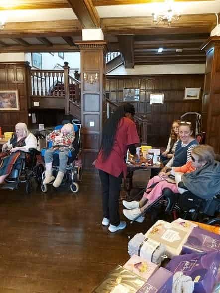 Spacious ground floor hall with care team and residents
