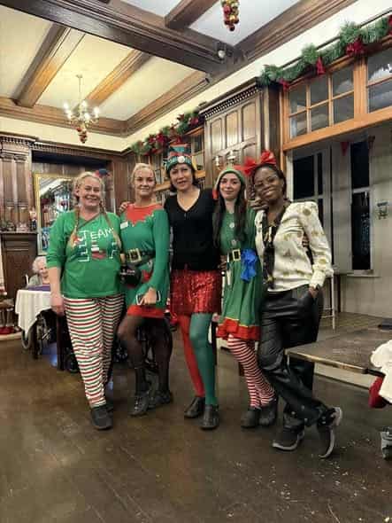 Our cheerful nursing and activities team in holiday attire